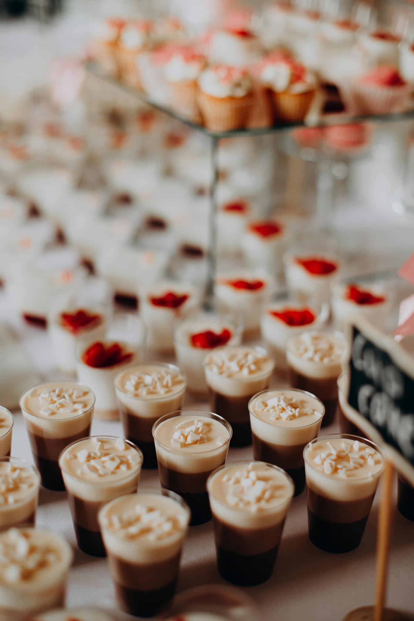 A delicious assortment of layered desserts and cupcakes, perfect for a festive gathering.